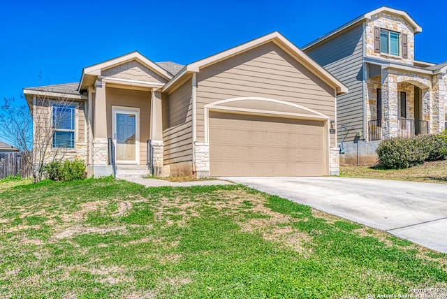 view of front facade featuring a front lawn, stone siding, driveway, and an attached garage