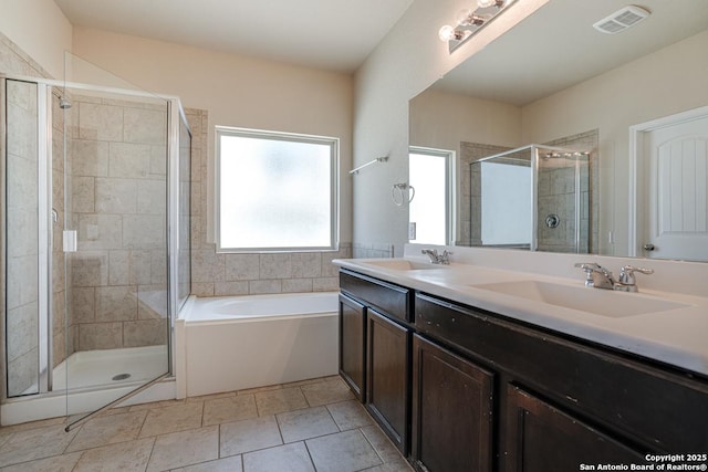 bathroom with a stall shower, visible vents, a sink, and a bath