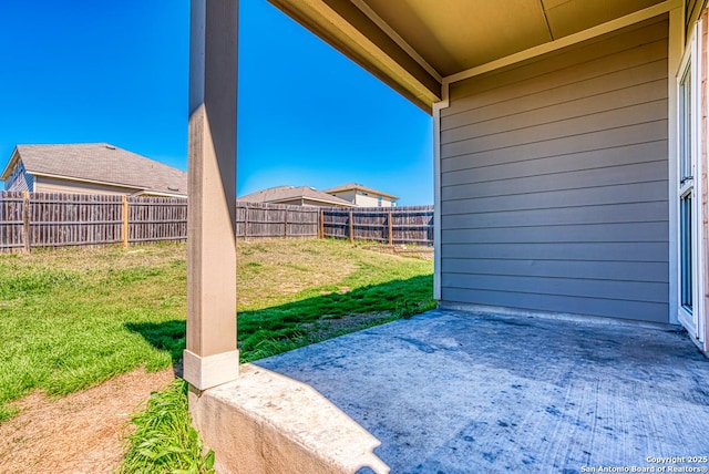 view of yard with a patio area and a fenced backyard