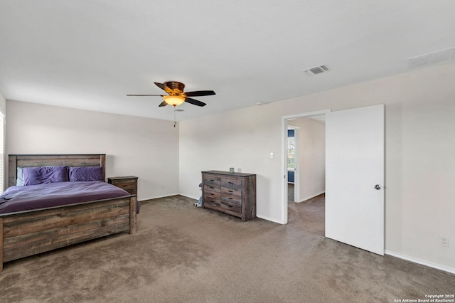 carpeted bedroom with visible vents and a ceiling fan