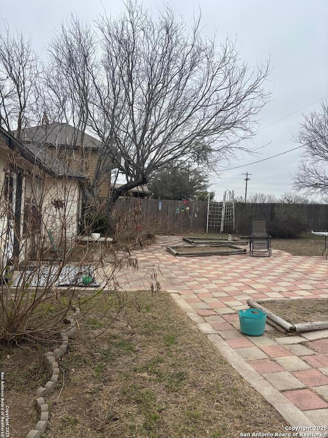 view of yard featuring a patio area and fence