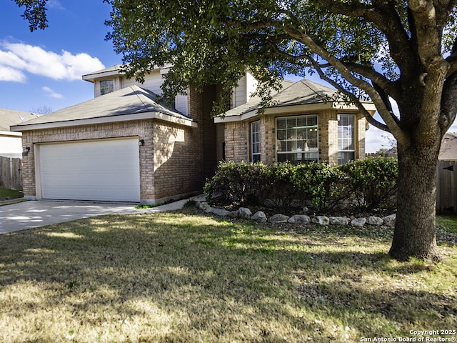 view of front of home with a garage, concrete driveway, fence, a front yard, and brick siding