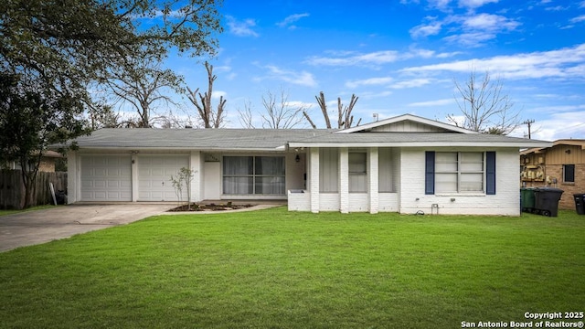 ranch-style home with driveway, an attached garage, and a front yard