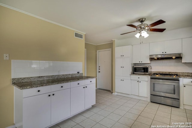 kitchen featuring visible vents, appliances with stainless steel finishes, under cabinet range hood, white cabinetry, and backsplash