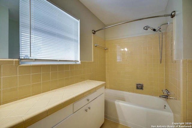 bathroom with shower / tub combination