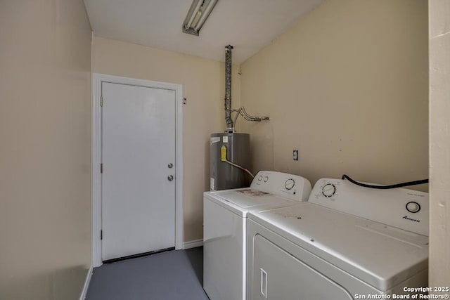 laundry room with laundry area, washer and clothes dryer, and gas water heater