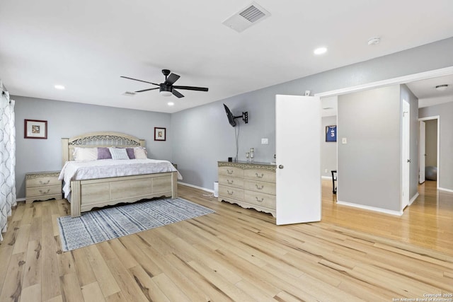 bedroom featuring light wood-type flooring, visible vents, and recessed lighting