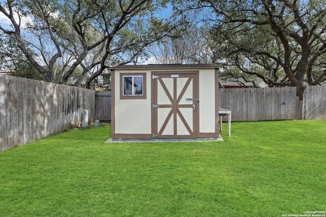 view of shed featuring a fenced backyard