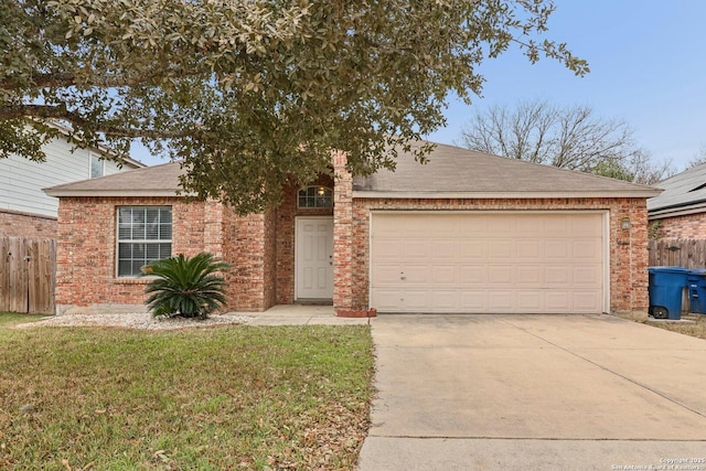 single story home with driveway, brick siding, an attached garage, and a front yard