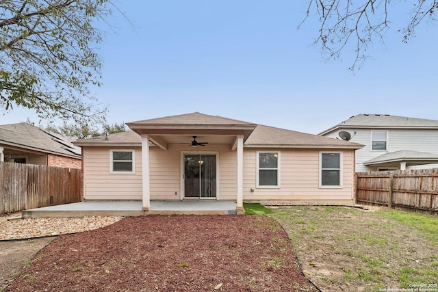 back of property with a ceiling fan, a patio area, and a fenced backyard