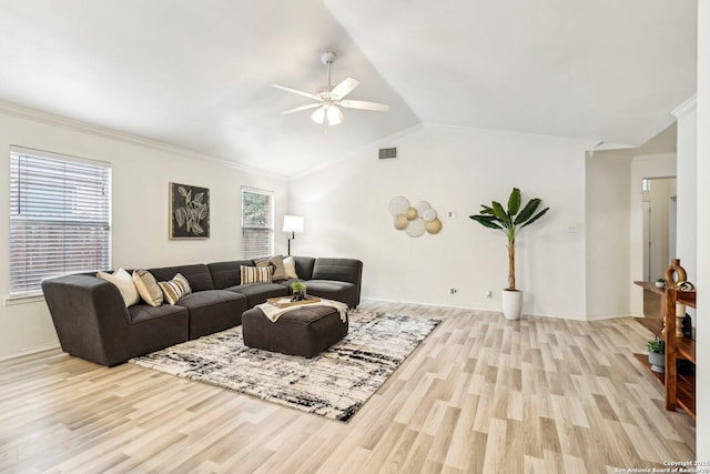 living room featuring vaulted ceiling, light wood-type flooring, visible vents, and crown molding