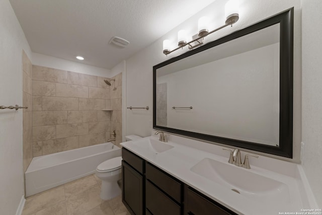 bathroom with toilet, tile patterned floors, a sink, and shower / bathtub combination