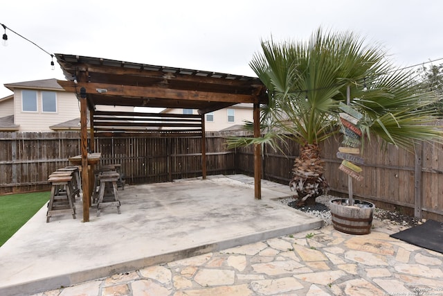 view of patio with a fenced backyard and a pergola