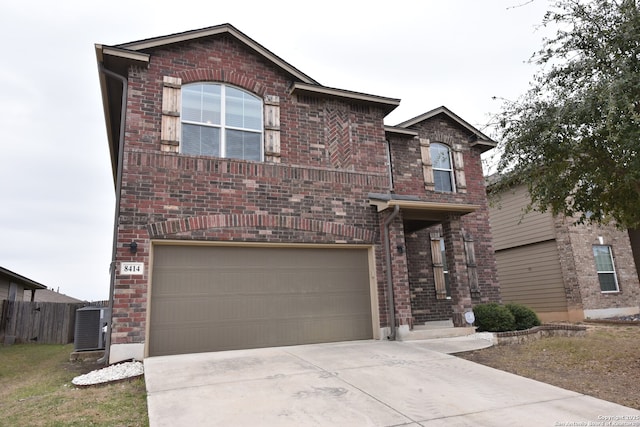 view of front facade with brick siding, central AC, fence, a garage, and driveway