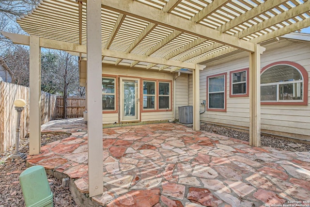 view of patio / terrace featuring central AC unit, a fenced backyard, and a pergola