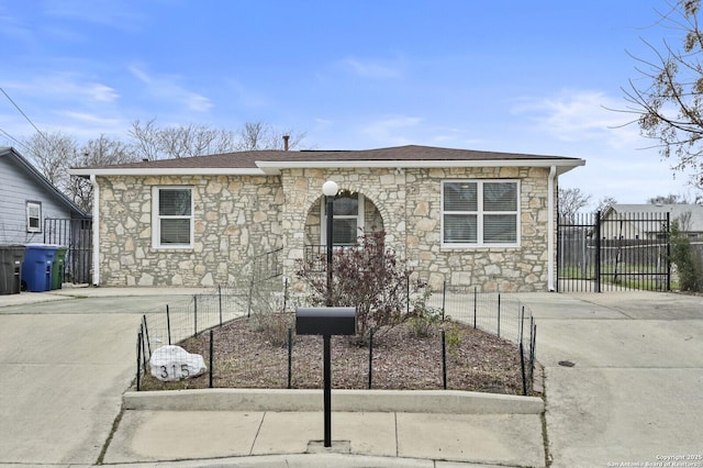 view of front of house featuring fence and a gate