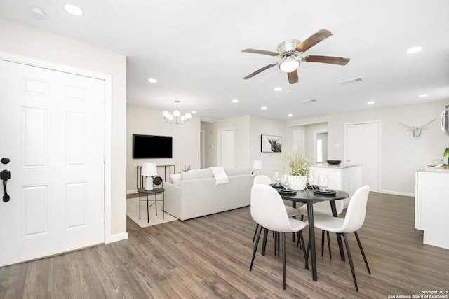 dining area with dark wood-style floors, ceiling fan, visible vents, and recessed lighting