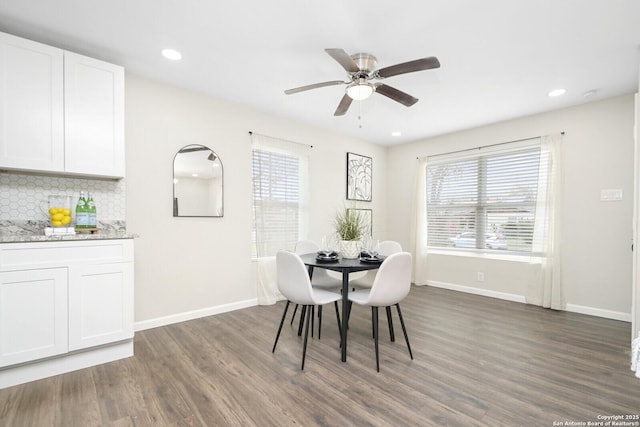 dining space with dark wood-style floors, recessed lighting, a ceiling fan, and baseboards