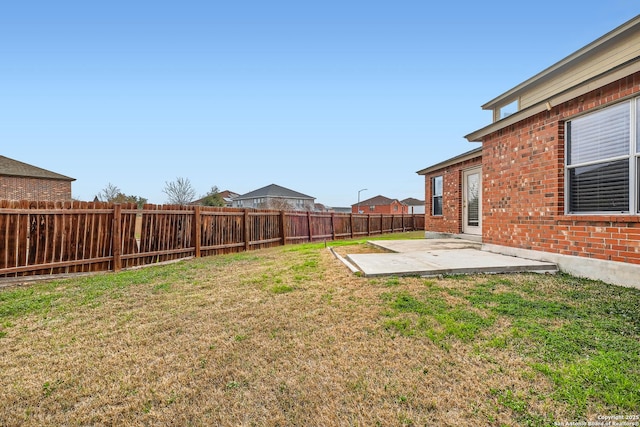 view of yard with a patio area and a fenced backyard