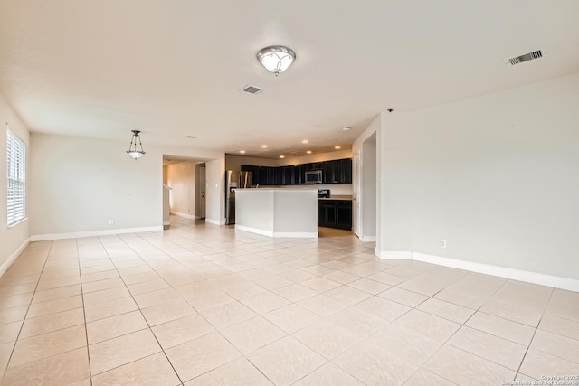 unfurnished living room with recessed lighting, visible vents, baseboards, and light tile patterned floors