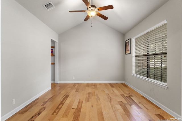 empty room with light wood-style floors, baseboards, visible vents, and a ceiling fan