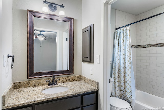 bathroom featuring toilet, ceiling fan, shower / bath combo with shower curtain, and vanity