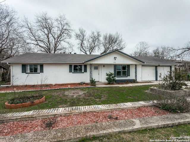 single story home with brick siding and an attached garage