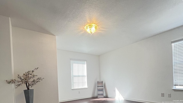 spare room featuring a textured ceiling