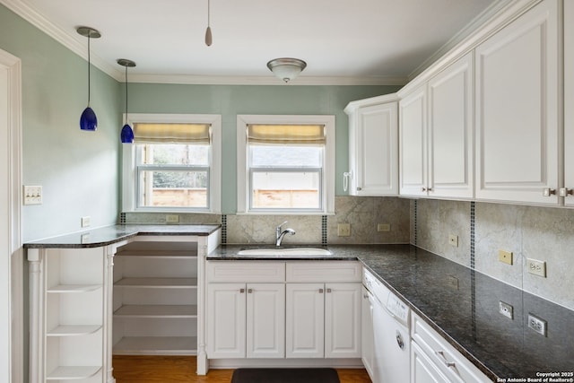 kitchen featuring decorative backsplash, white cabinets, a sink, white dishwasher, and dark stone countertops