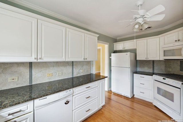 kitchen featuring white appliances, visible vents, white cabinets, ornamental molding, and light wood-style floors