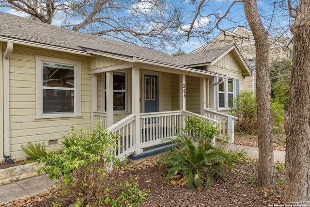 property entrance featuring crawl space and roof with shingles