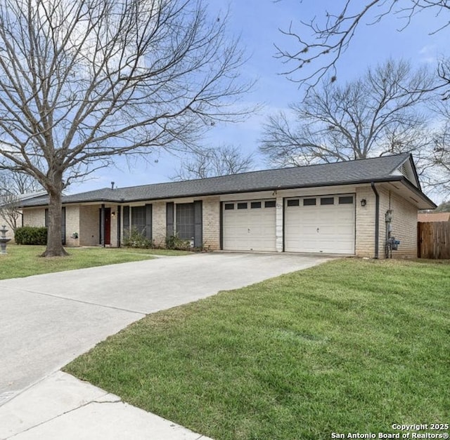 ranch-style house featuring an attached garage, brick siding, driveway, and a front yard