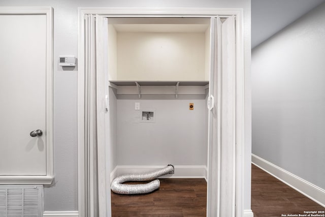 washroom featuring laundry area, dark wood-type flooring, washer hookup, and baseboards