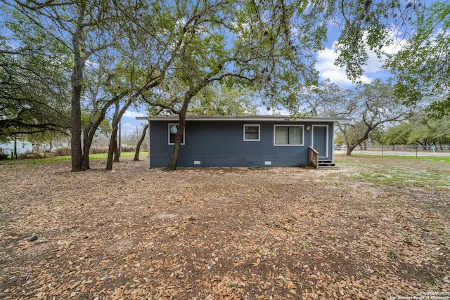 view of front facade with entry steps and crawl space