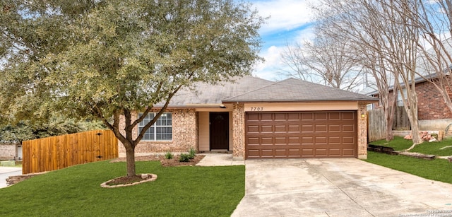 ranch-style home featuring a garage, driveway, a front lawn, and fence