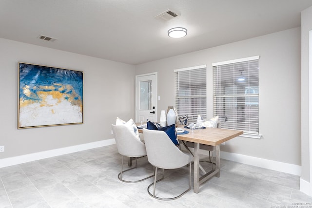 office space featuring visible vents and baseboards