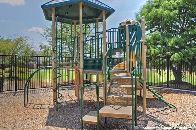 community jungle gym with fence