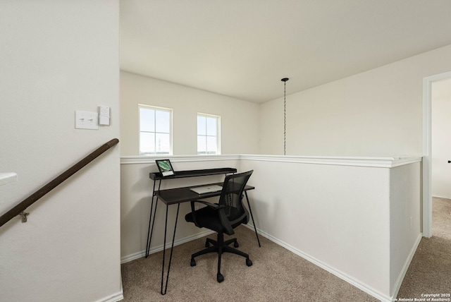 office space with carpet and baseboards