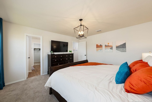 bedroom with carpet floors, baseboards, visible vents, and a chandelier