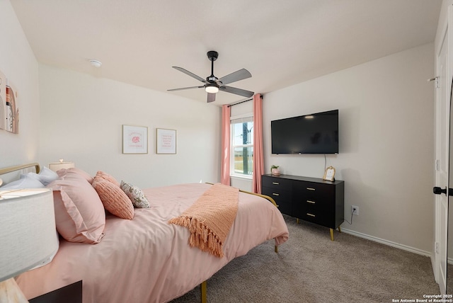 bedroom featuring a ceiling fan, carpet, and baseboards