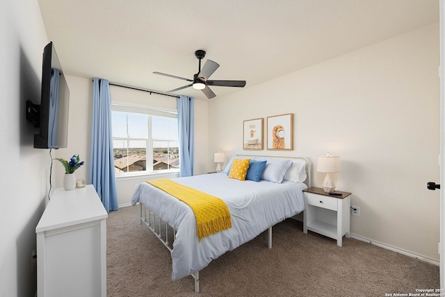 bedroom with carpet, baseboards, and a ceiling fan