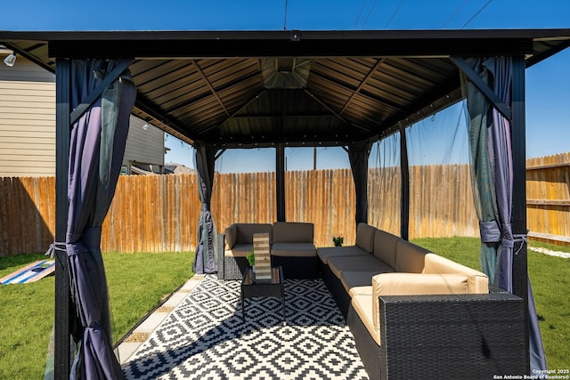 view of patio / terrace featuring a fenced backyard, an outdoor hangout area, and a gazebo