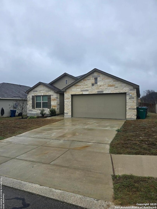 view of front of house with concrete driveway and an attached garage