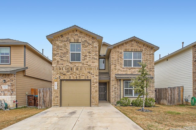 traditional-style house with an attached garage, brick siding, fence, driveway, and a front yard