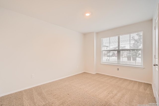 unfurnished room featuring carpet floors, baseboards, and recessed lighting