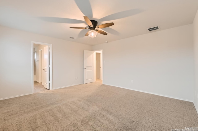 unfurnished room with light carpet, baseboards, visible vents, and a ceiling fan