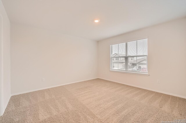 unfurnished room featuring carpet, baseboards, and recessed lighting