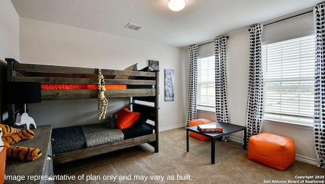 bedroom with carpet floors, visible vents, and baseboards