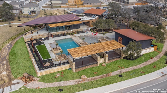 birds eye view of property with a residential view