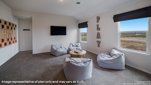 living room featuring carpet, visible vents, and baseboards